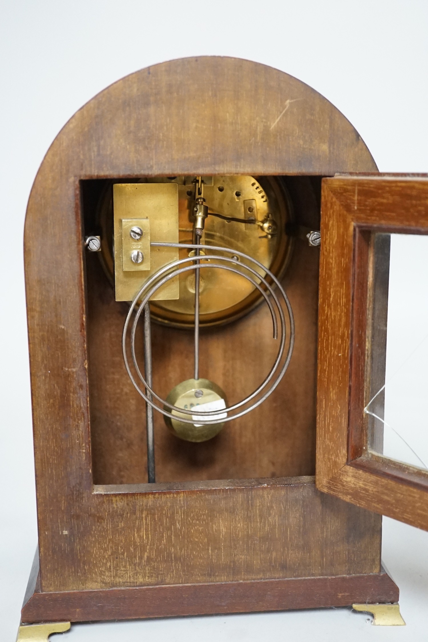 An Edwardian brass mounted mantel clock, 28.5cms high